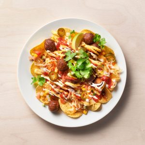 Plant balls with nachos, cabbage, salsa and cheese dip.
